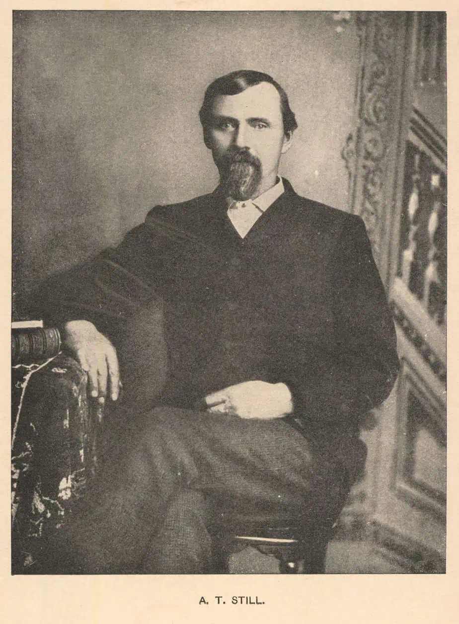 A **post**card of a man sitting on a chair.